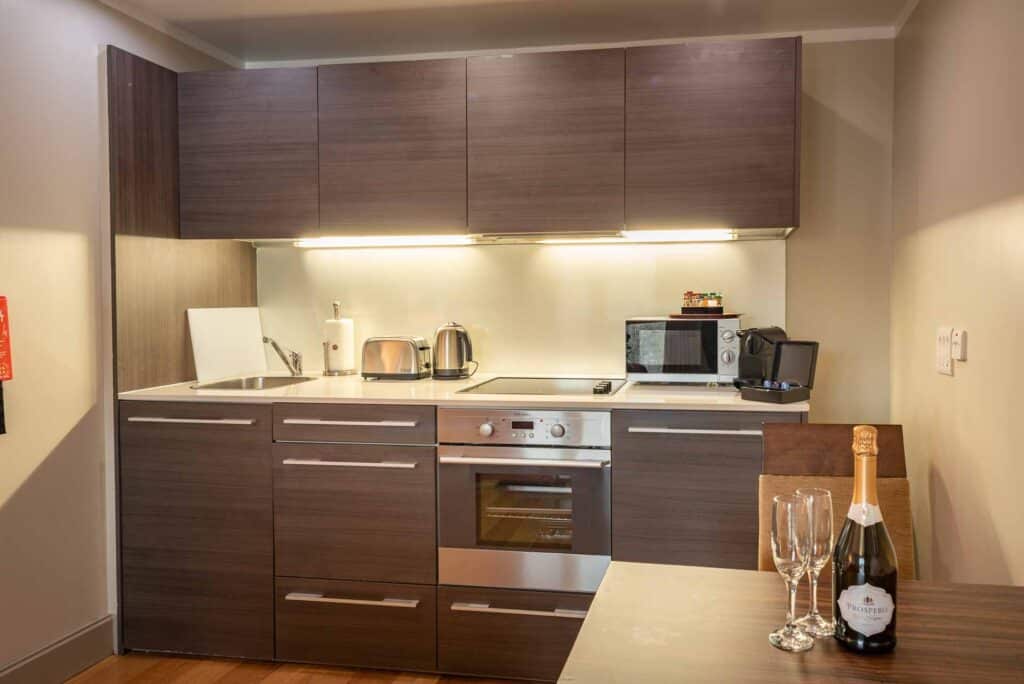 Kitchen and dining table at PREMIER SUITES Bristol Cabot Circus