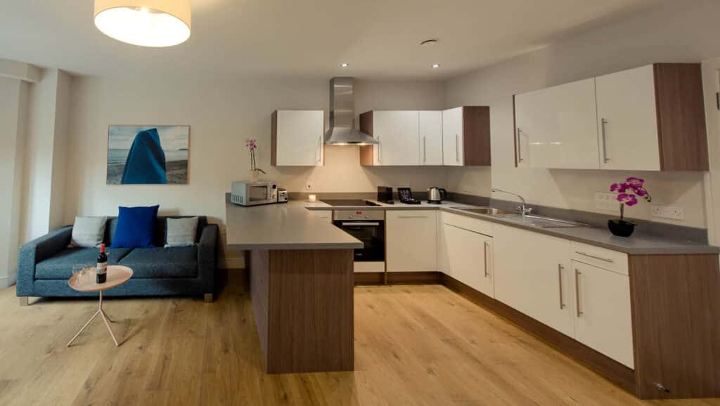 Kitchen and living area of a one bed apartment PREMIER SUITES Glasgow Bath Street